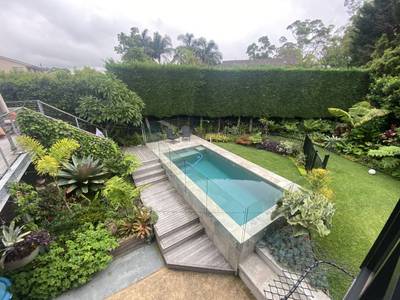 The pool terrace, planted to the edges